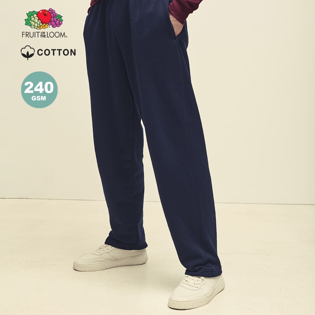 Lightweight navy open hem trousers with pockets, paired with white trainers, featuring a brand logo. Lightweight Open Hem Trousers - Image 1
