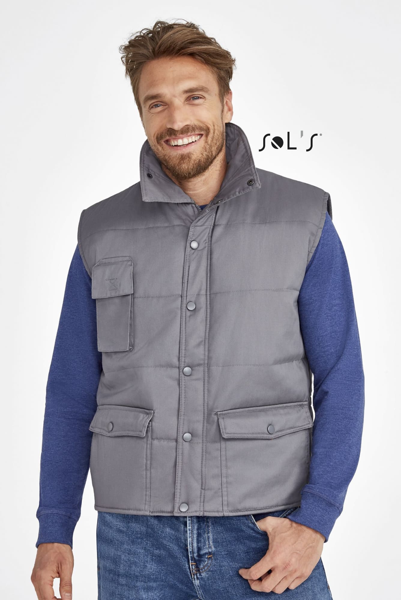 A grey vest with multiple exterior pockets, featuring a collar, worn over a blue long-sleeve shirt. Vest with multiple exterior pockets EQUINOX PRO WORKWEAR - Image 1