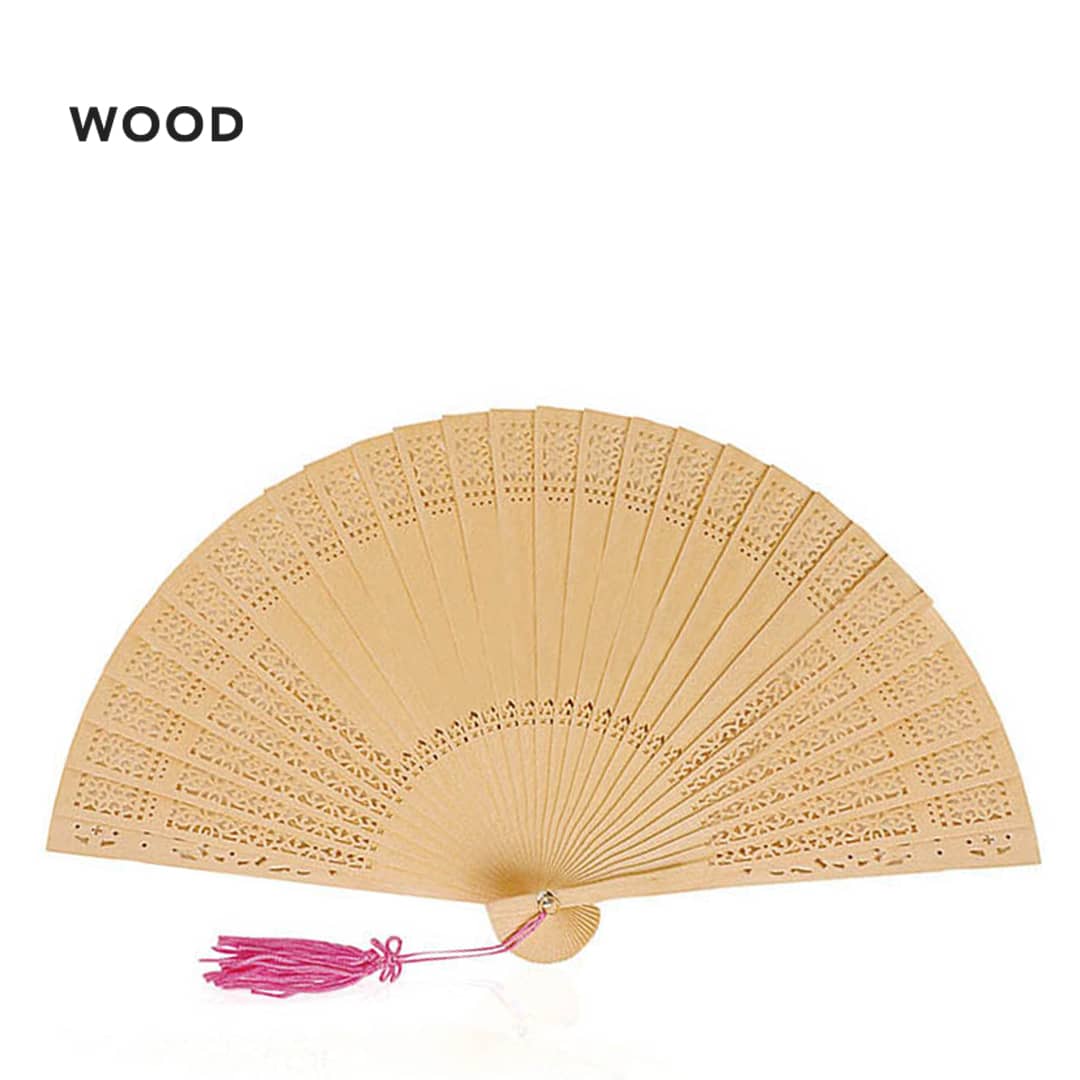 A wooden hand fan in a light beige colour, featuring intricate cut-out patterns and a pink tassel. Madera Hand Fan - Image 1