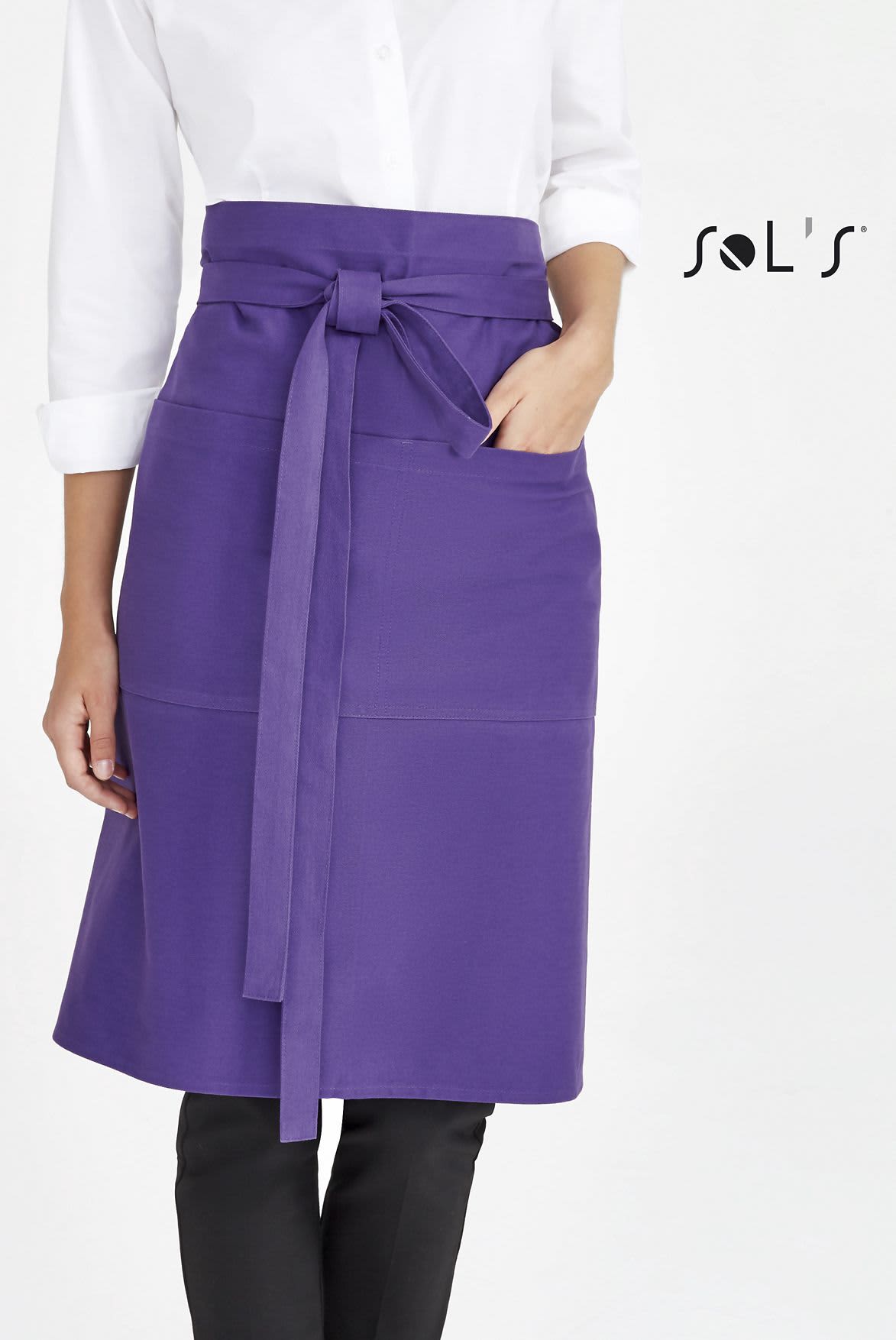 A purple waist apron with pockets, featuring a tied waist and worn by a model in a white shirt. APRON waist style with pockets - Image 1