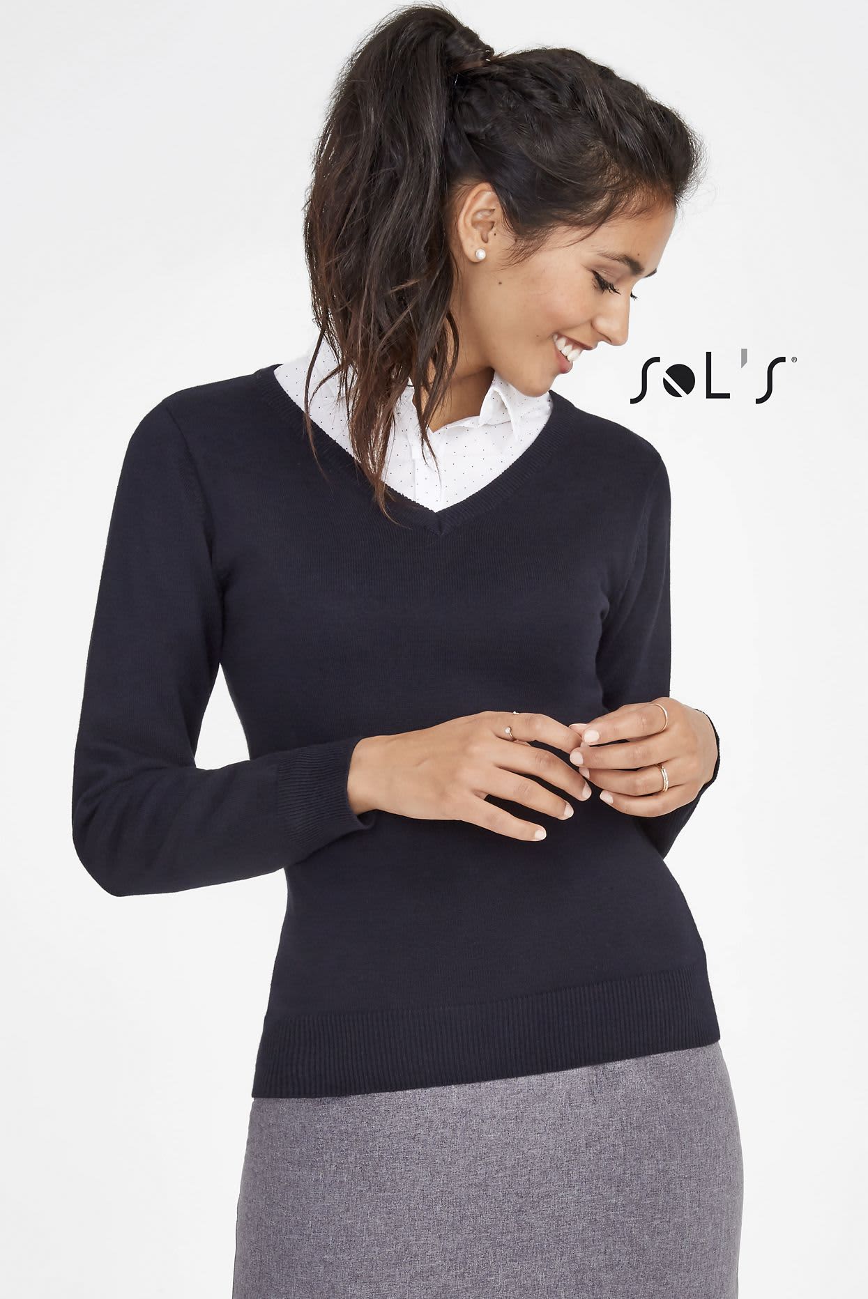 A navy women's V-neck jumper with long sleeves, paired with a collared shirt and grey skirt. Features a logo. Jumper womens V neck GALAXY - Image 1