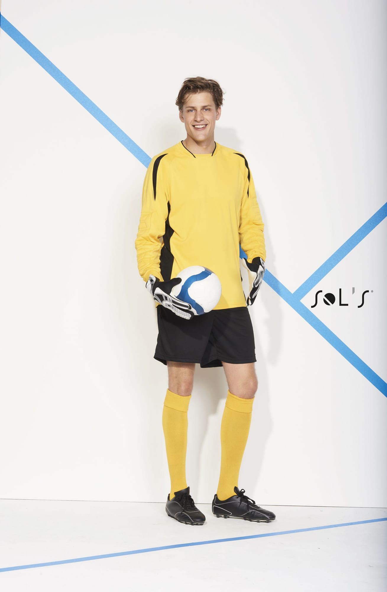 A soccer goalkeeper shirt in bright yellow with black accents, paired with black shorts and goalkeeper gloves. Soccer GOALKEEPER SHIRT Adult Azteca - Image 1