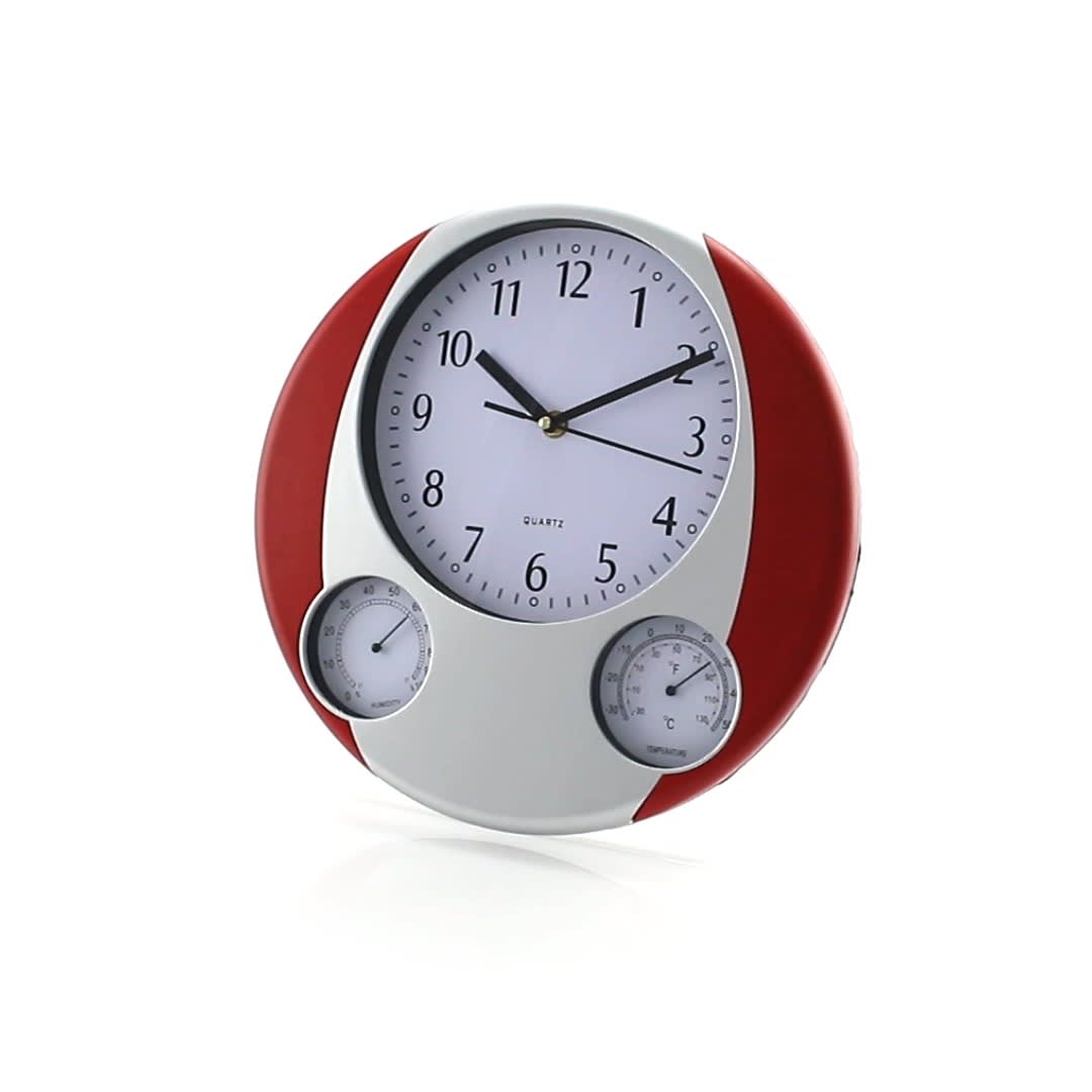 A round wall clock with a white face, bold black numbers, and red accents. It features temperature and humidity gauges. Prego Wall Clock - Image 1