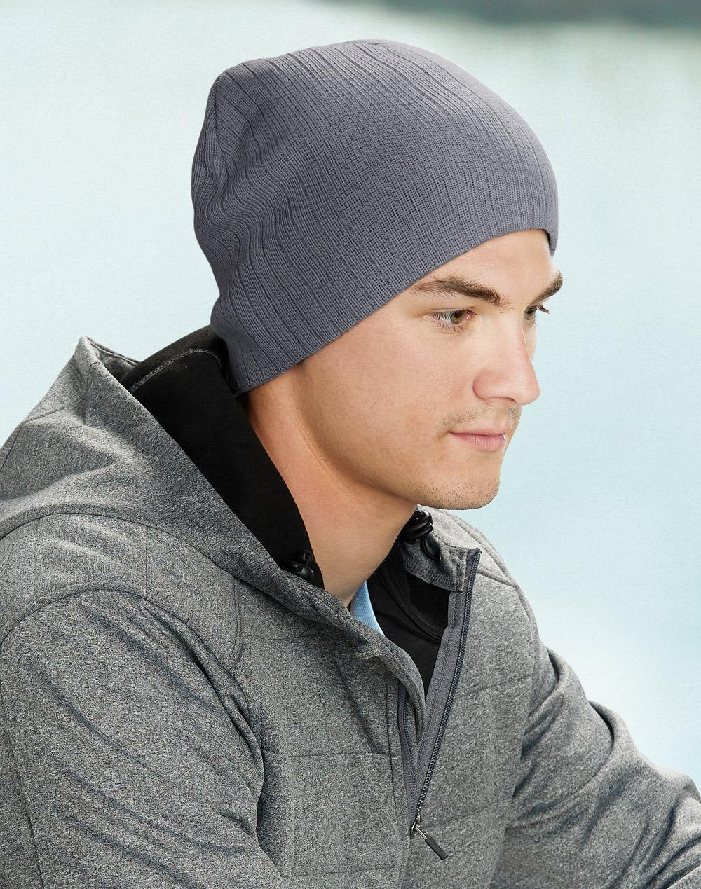 A cable knit beanie in a dark grey colour, featuring a ribbed texture and a simple design. Acrylic knit beanie with cable row feature - Image 1