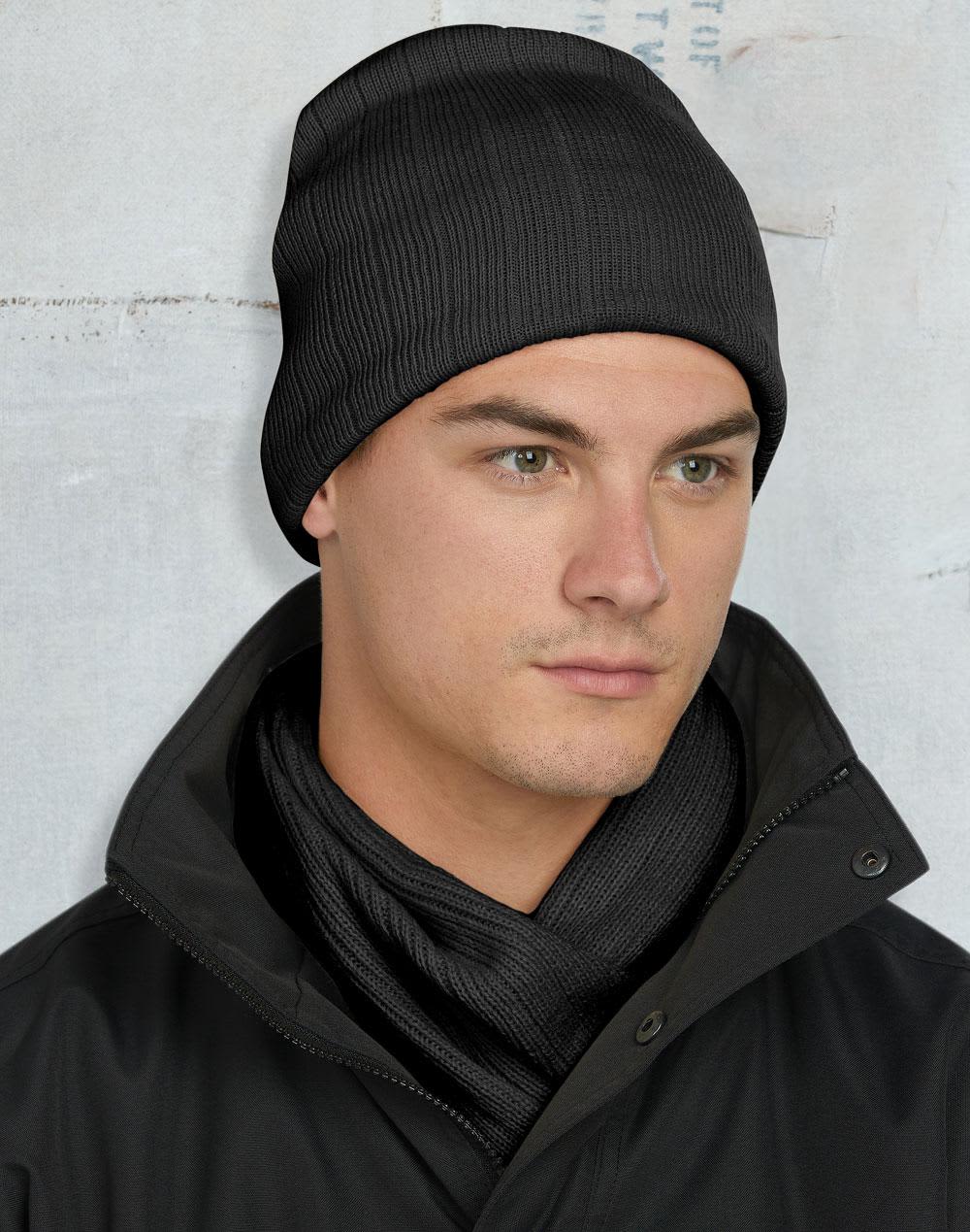 A cable knit beanie in dark green with a fleece headband inside and a logo. Cable Knit Beanie with Fleece Head Band - Image 1
