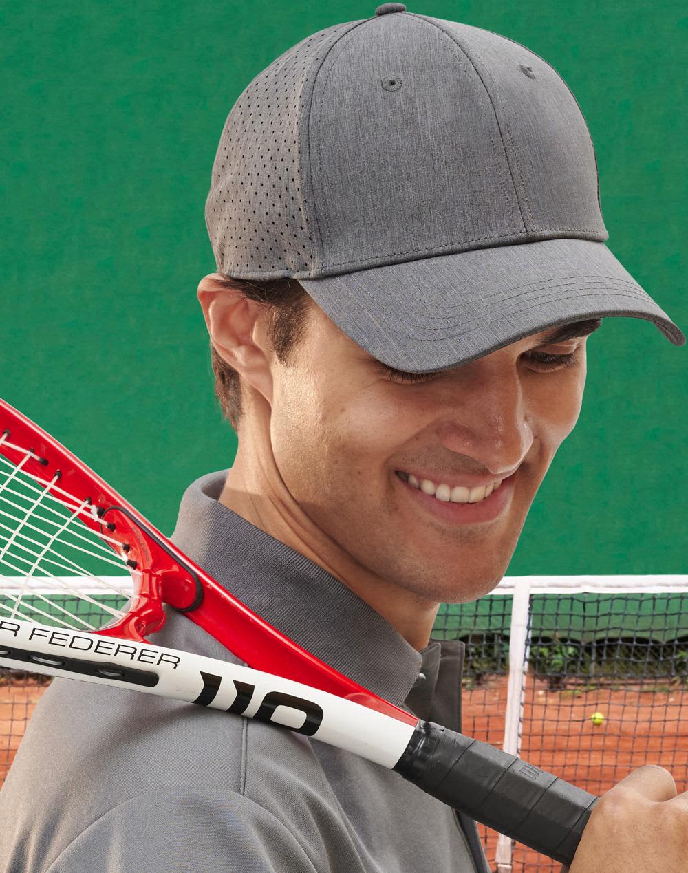 A grey 4-way stretch cap with a perforated design worn by a smiling man holding a tennis racquet. 4-Way Stretch Laser Cut Runner's Cap - Image 1