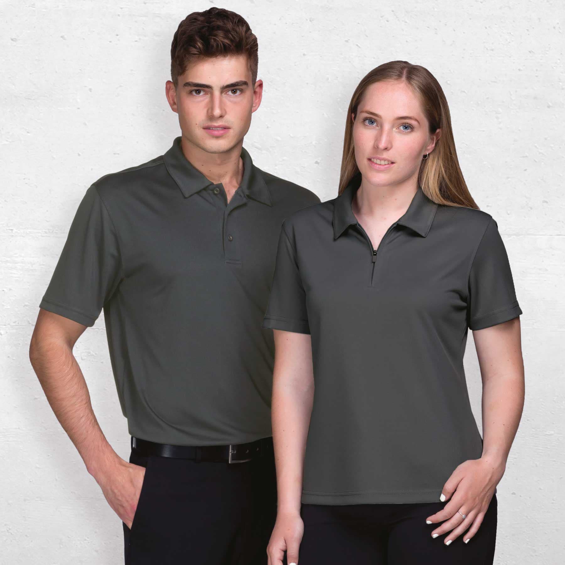 A grey Dri Gear Axis Polo for men and a matching women's version, both featuring a logo. Dri Gear Axis Polo - Mens - Image 1