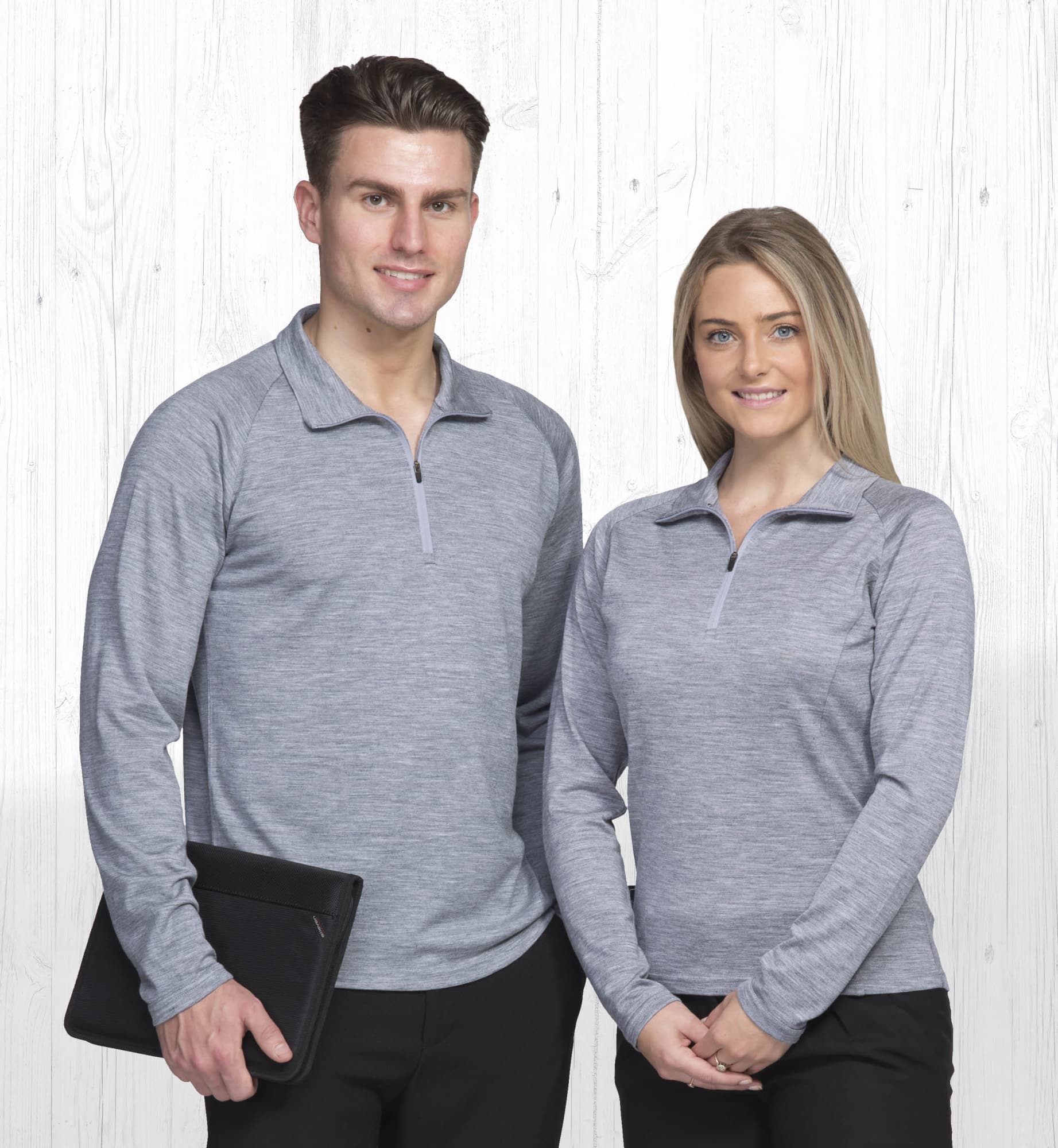 A grey Merino Zip Pullover for women displayed on a model, featuring a zip-neck design and long sleeves. Merino Zip Pullover - Womens - Image 1