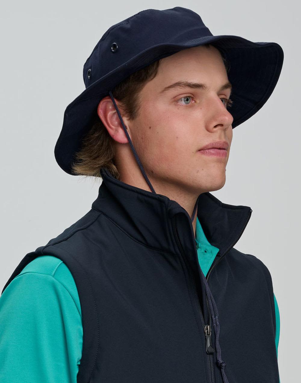 A blue surf hat with a wide brim and a clip-on chin strap, featuring a logo on the side. Surf hat with clip on chin strap - Image 1