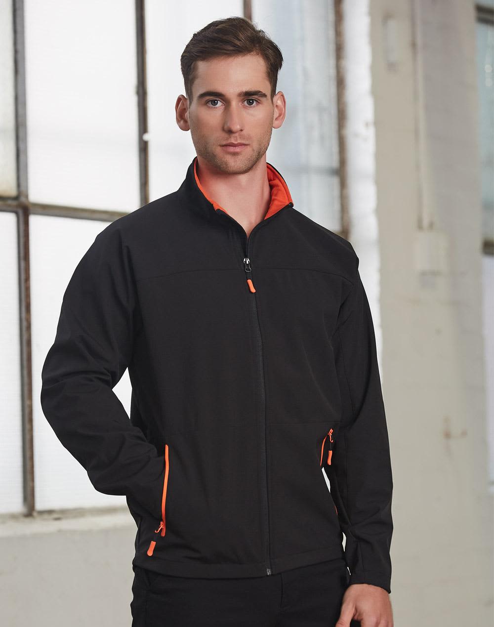 A men's softshell jacket in black with orange accents, featuring a zippered front and pockets. It has a logo. Men's Softshell Contrast Jacket - Image 1