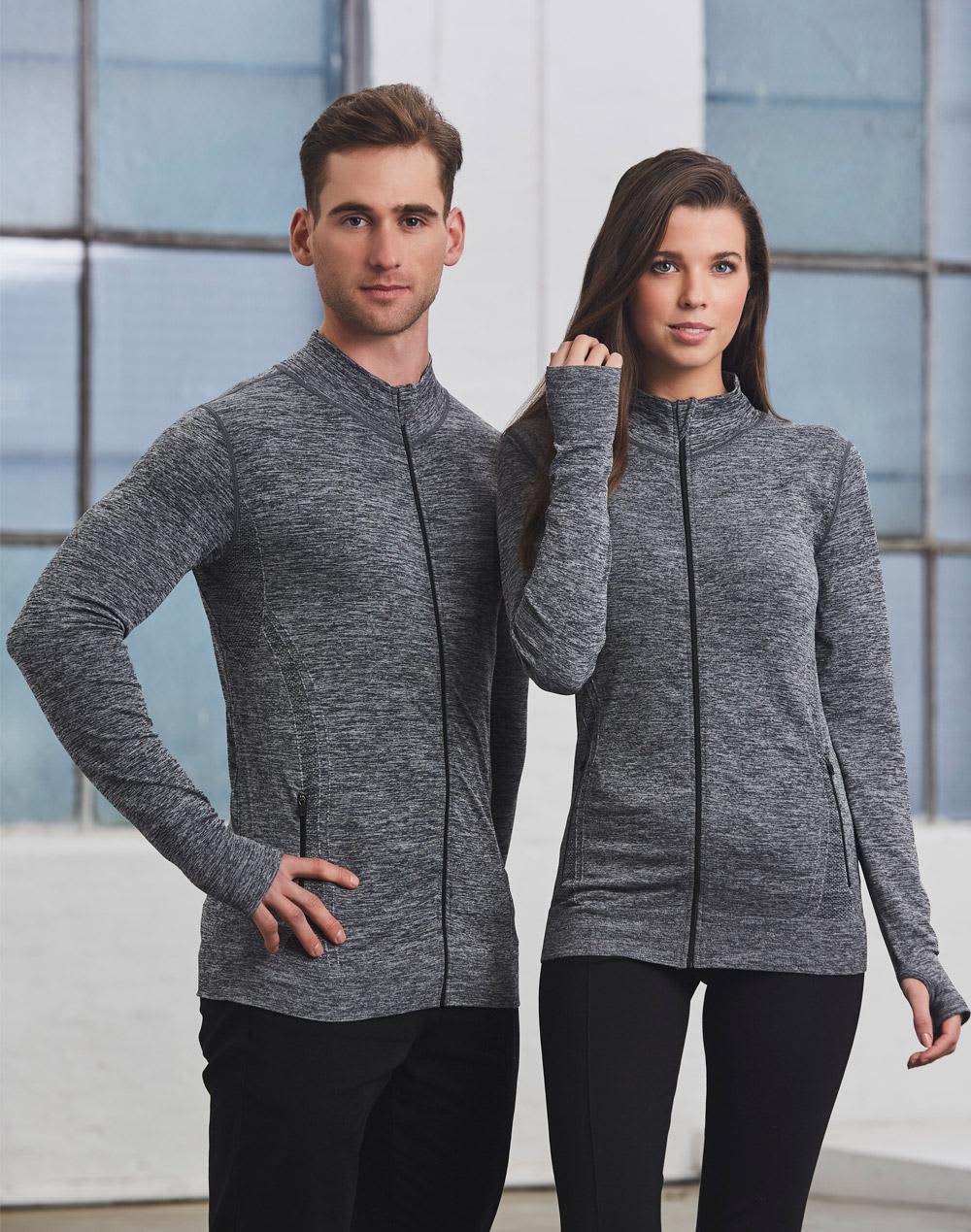 A unisex seamless heather jacket in grey, featuring a zip front and two models standing side by side. Unisex Seamless Heather Jacket - Image 1