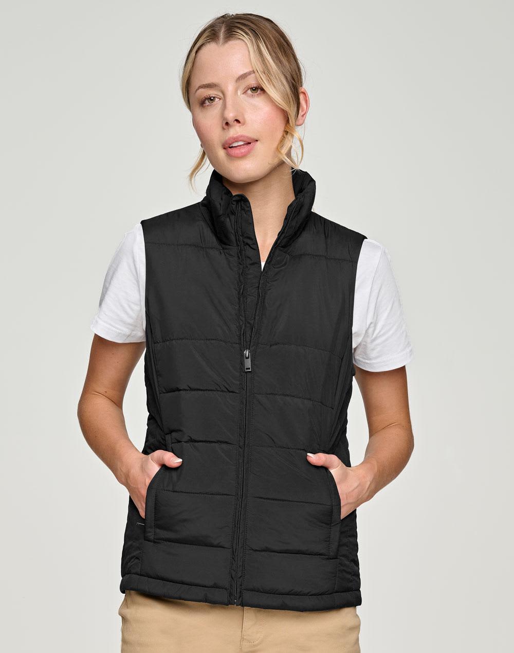 A black insulated puffer vest with a 3D cut design, featuring side pockets and a front zip. Ladies' Sustainable Insulated Puffer Vest (3D Cut) - Image 1