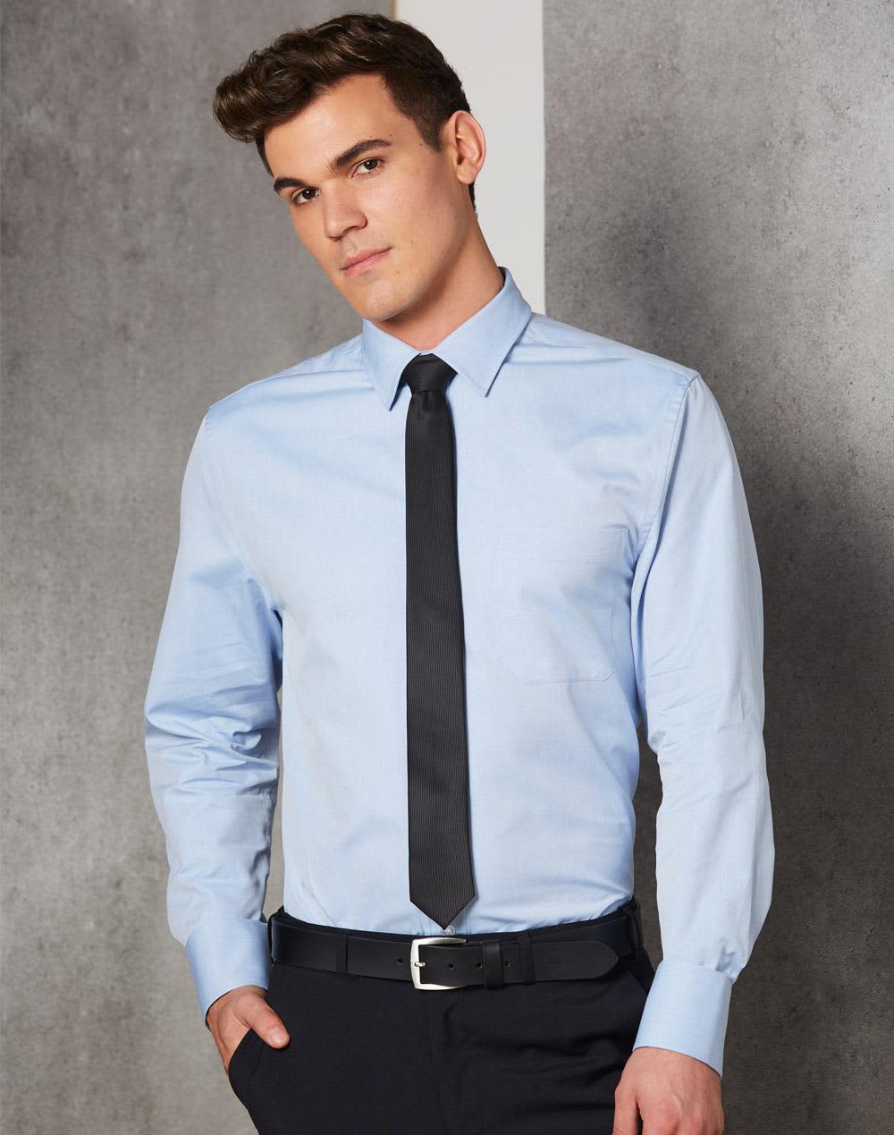 A light blue men's button-up shirt with long sleeves, featuring a collar and a black tie. The model is standing against a neutral background. Men's Pinpoint Oxford L/S Shirt - Image 1