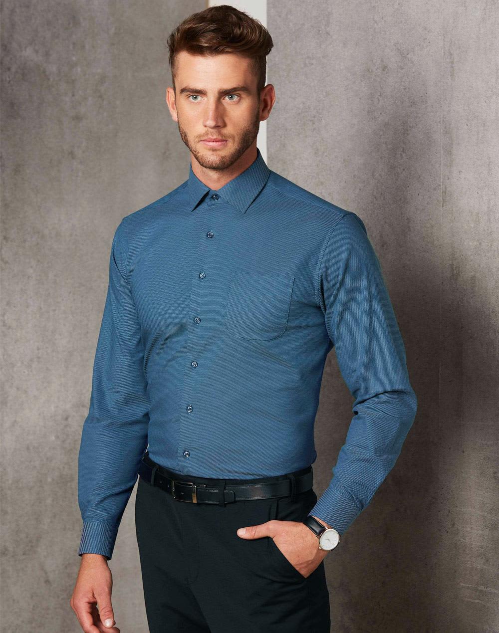 Men's pin dot stretch long-sleeve shirt in teal blue, featuring a collar and single chest pocket, with branding visible. Men's Pin Dot Stretch L/S Shirt - Image 1