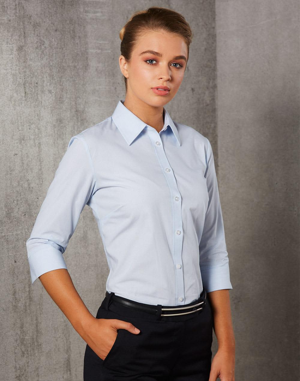 A light blue women's button-up shirt with 3/4 sleeves and a fitted design, featuring a logo on the chest. Women's Fine Stripe 3/4 Sleeve Shirt - Image 1