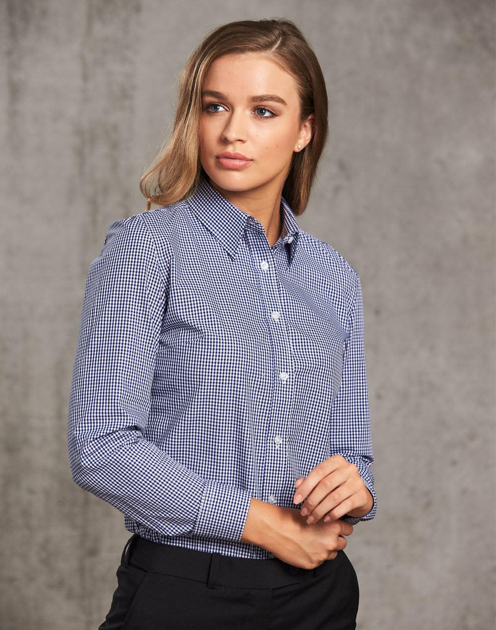 A ladies' long-sleeve button-up shirt in navy and white check pattern, featuring a collar and logo branding. Ladies' Two Tone Check L/S Shirt - Image 1