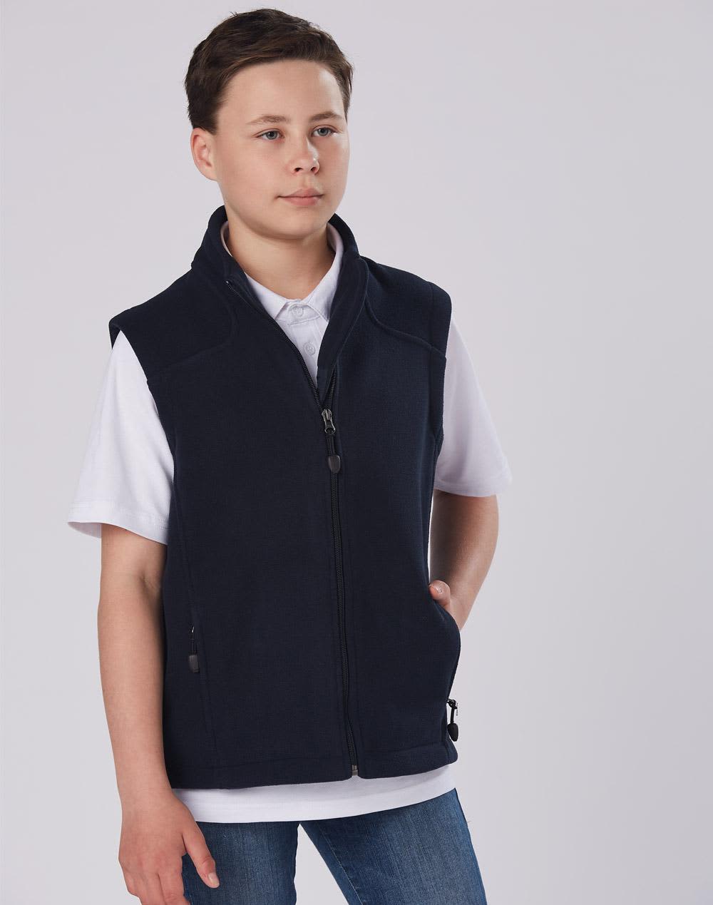 A diamond fleece vest in navy worn by a child, featuring a zip fastening and side pockets. Kids' bonded polar fleece vest - Image 1