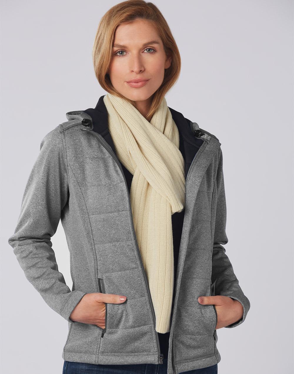 A woman wearing a grey jacket and a cream cable knit scarf, showcasing the scarf's texture and style. Cable Knit Scarf (Acrylic knit with cable row feature) - Image 1