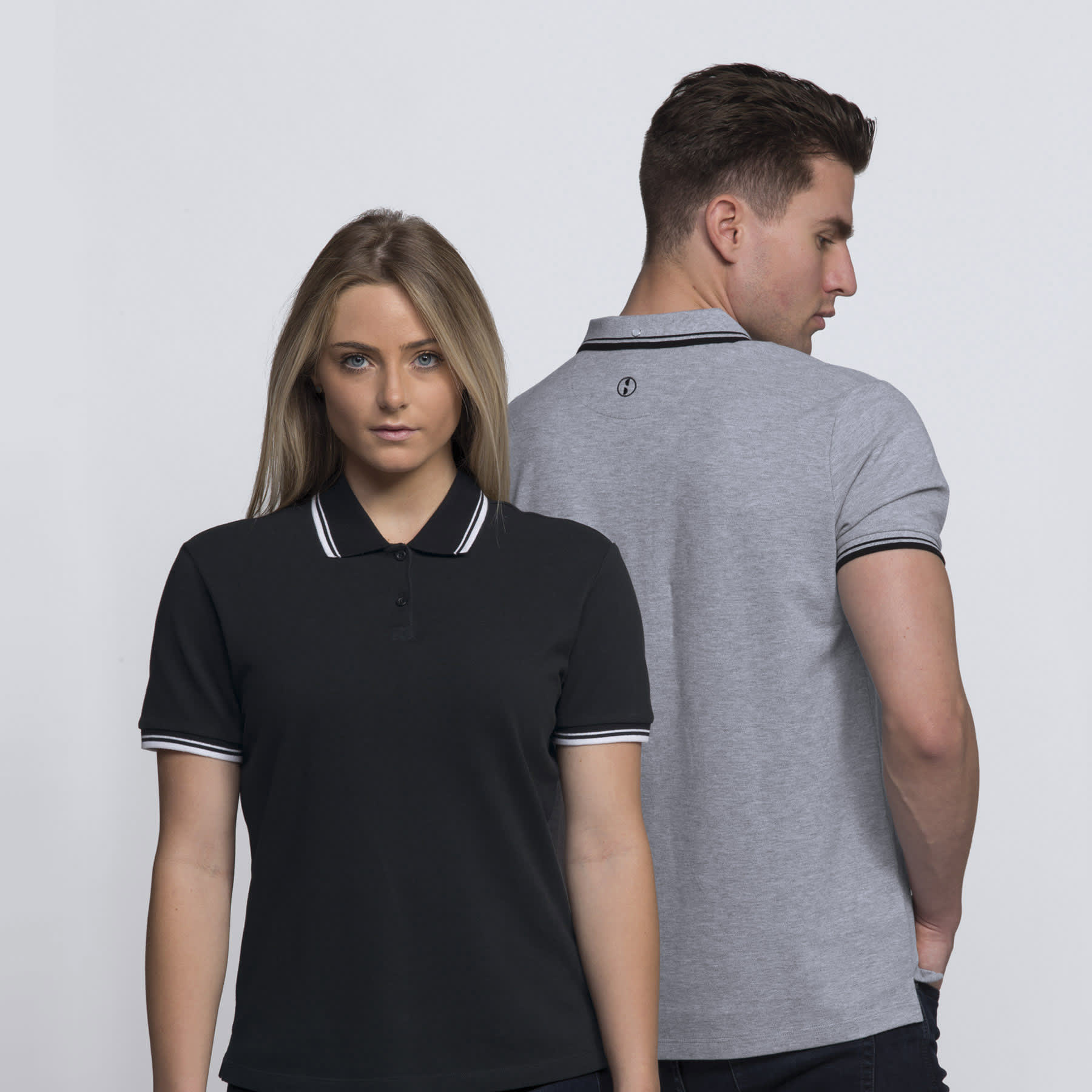 A black and grey polo shirt featuring contrasting stripes and a logo on the back. smpli Womens Stanton Polo - Image 1