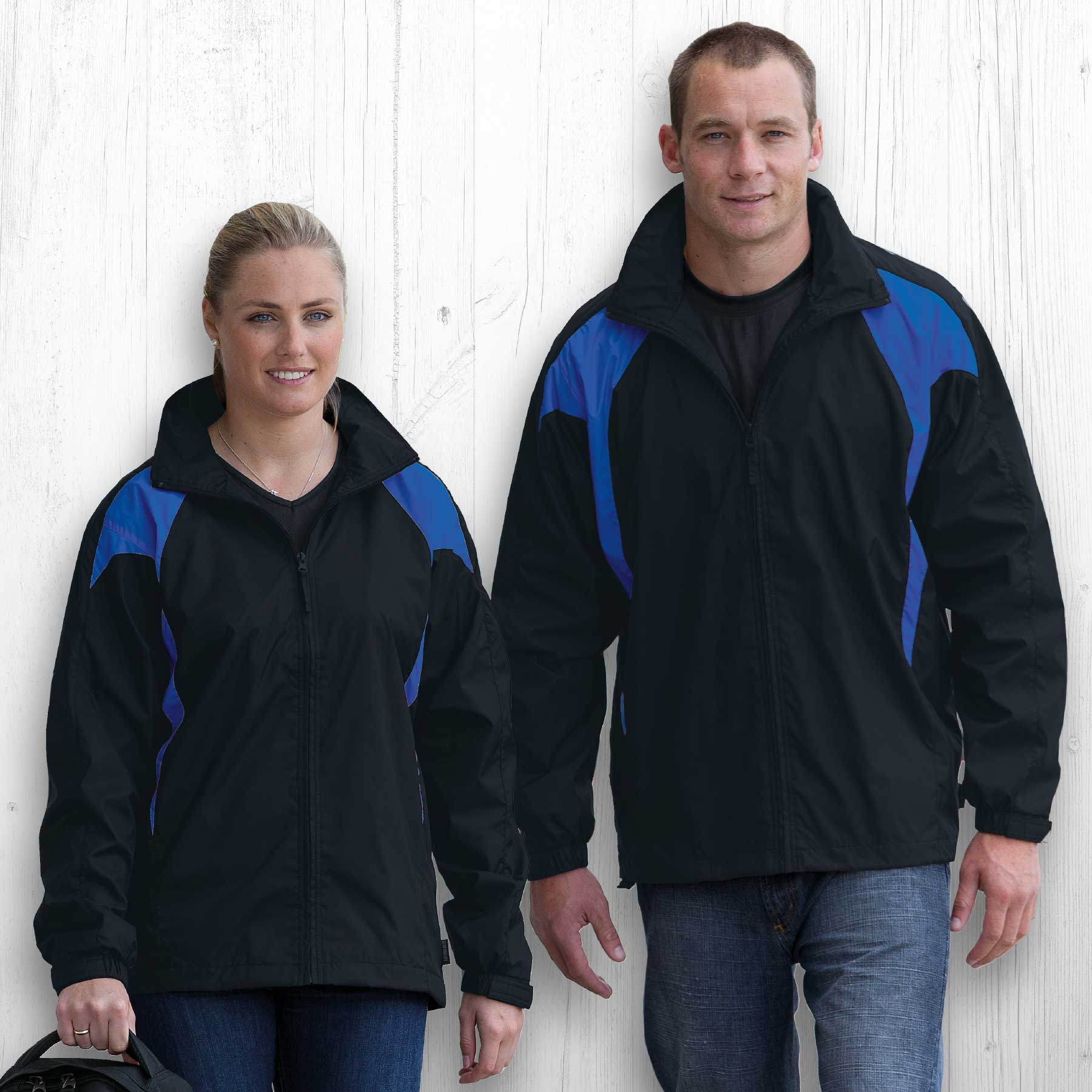 A black rain jacket featuring blue accents, displayed on both a male and female model. The jacket includes a logo. Spliced Zenith Jacket - Image 1