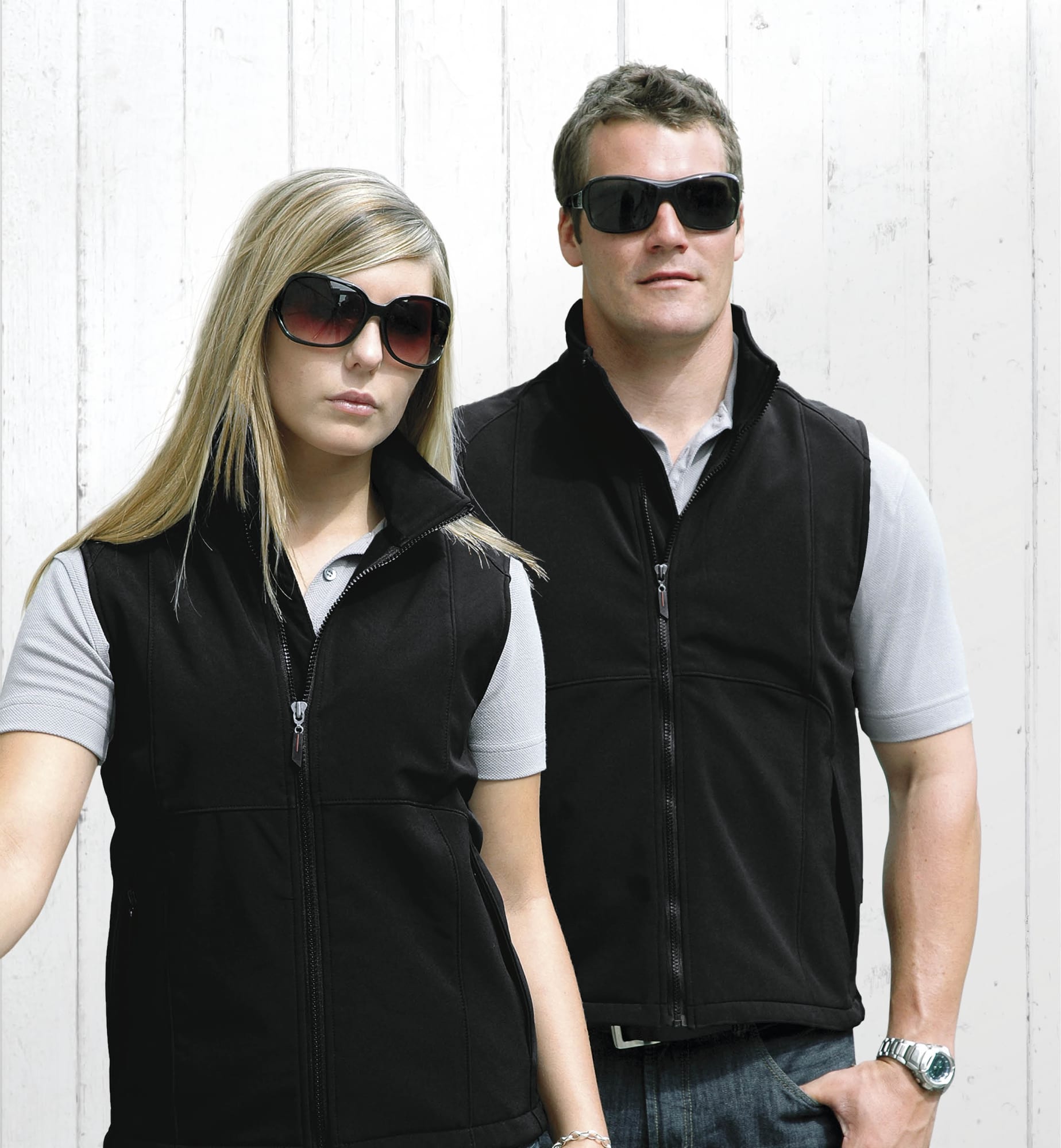 A black soft shell vest for men and women, featuring a zip closure and a logo. Summit Vest - Image 1
