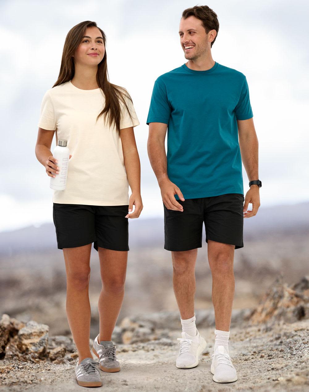 Unisex Mercerised Cotton Shorts in black, worn by a woman with a cream top and a man in a teal shirt, both smiling. Unisex Mercerised Cotton Shorts - Image 1