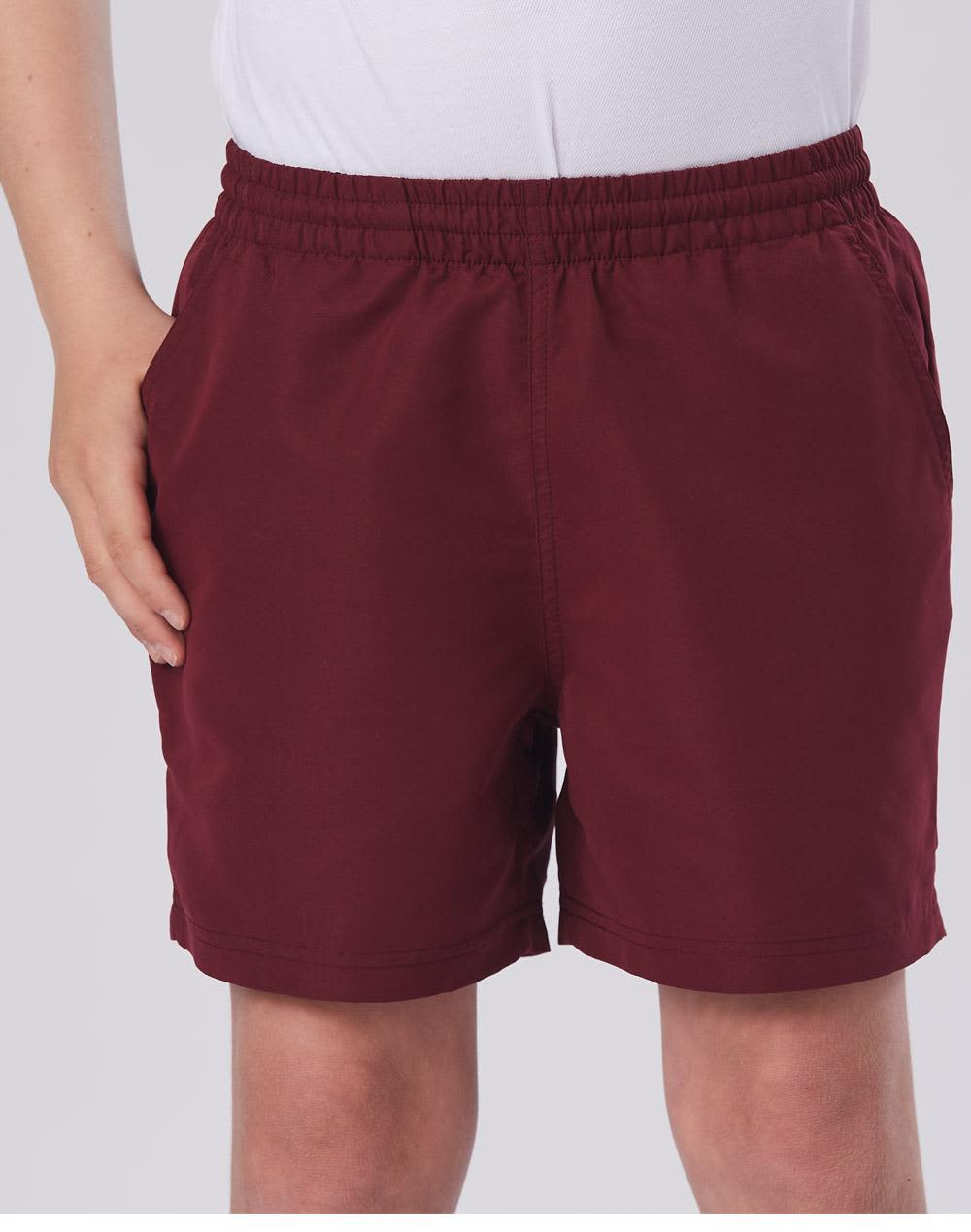 Kids microfibre sports shorts in a deep burgundy colour, featuring an elastic waistband and side pockets. Kids microfibre shorts - Image 1