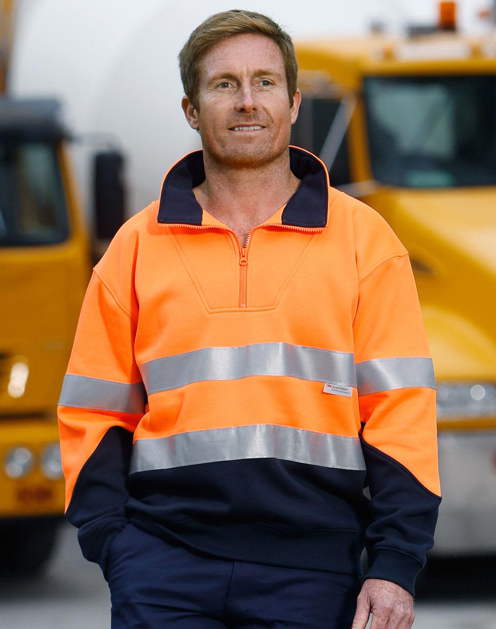 Hi-Vis long-sleeve fleece collar sweater in orange with reflective strips, paired with navy trousers. Features branding. Hi-Vis L/S Fleecy Collar Sweater 3M Tapes - Image 1