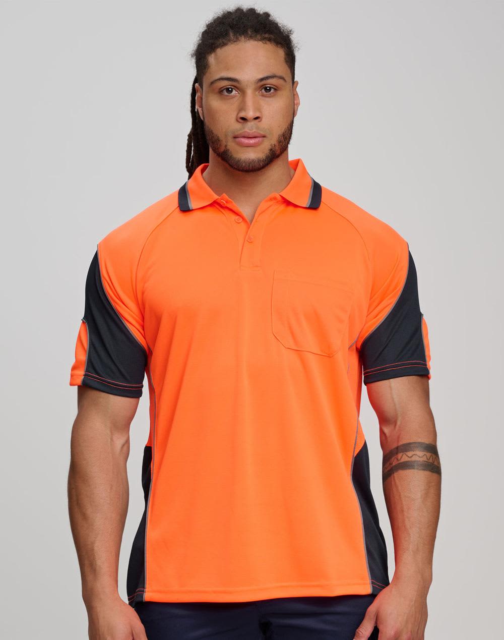 Two individuals stand in high-visibility yellow safety polo shirts with navy accents, inside an unfinished building. Cooldry Hi-Vis Mini Waffle Safety Polo - Image 1