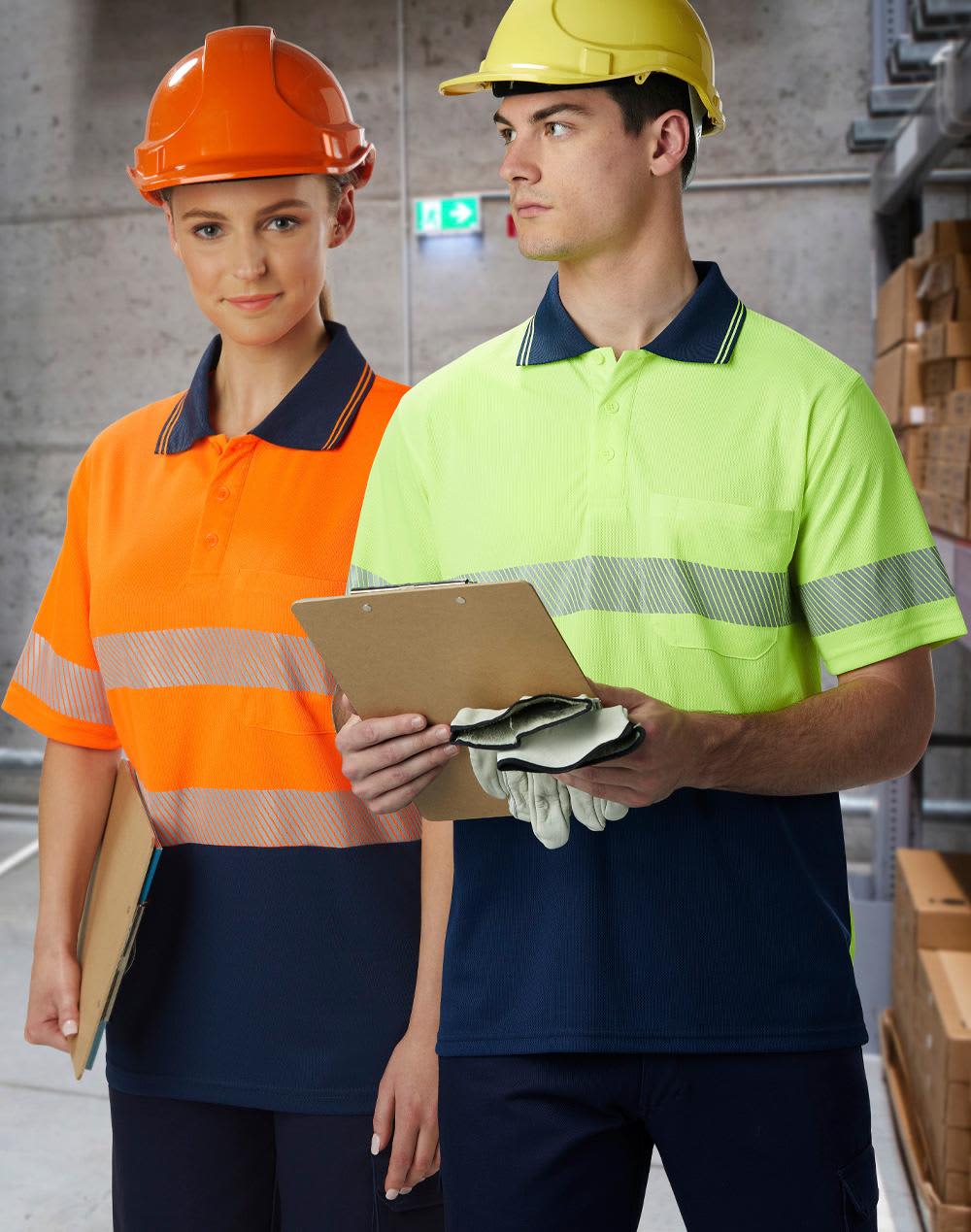 Unisex Cooldry Segmented Safety S/S Polo in orange and yellow, modelled by two people wearing safety helmets. Unisex Cooldry Segmented Safety S/S Polo - Image 1