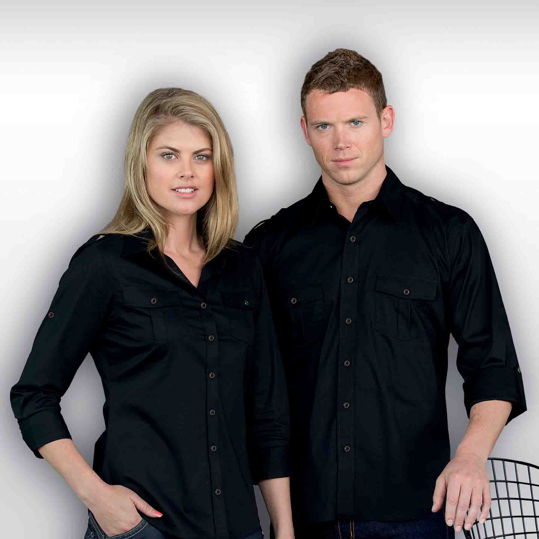 A black button-up shirt for men, featuring two chest pockets and a classic collar, displayed alongside a similar women's shirt. The Protocol Shirt - Mens - Image 1