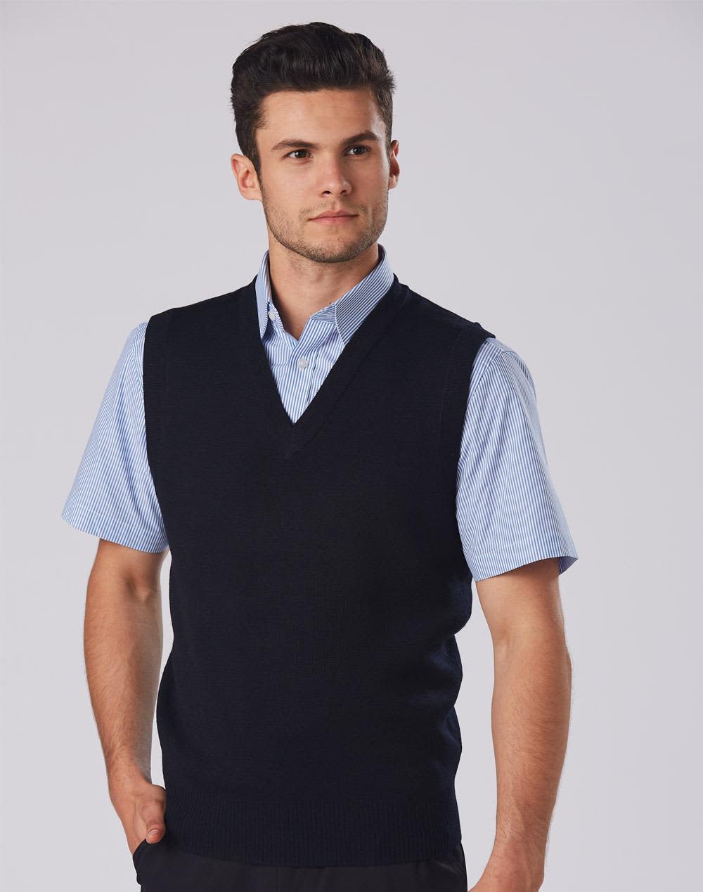 A navy V-neck wool and acrylic knit vest worn over a light blue collared shirt, featuring a logo. V Neck Wool / Acrylic Knit Vest - Image 1