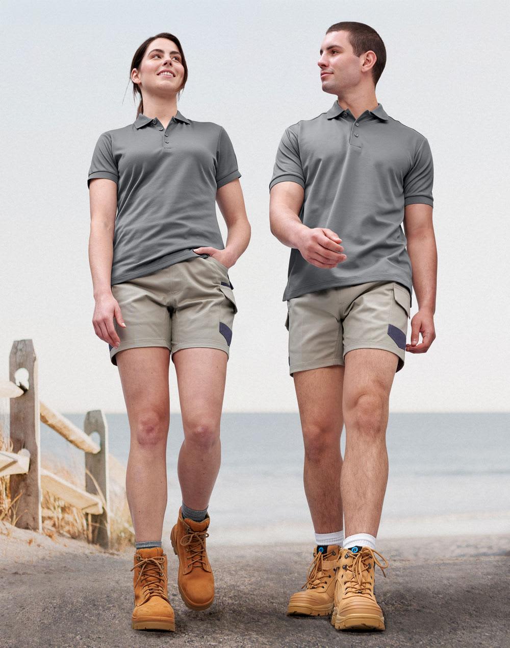 A pair of unisex cotton stretch drill short work shorts in light grey, worn by a male and female model. Unisex Cotton Stretch Drill Short Work Shorts - Image 1