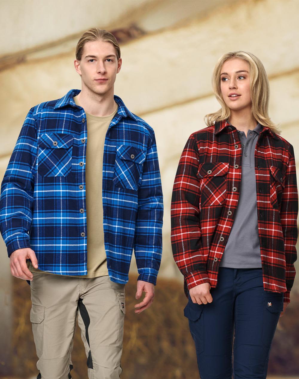 A blue and black quilted flannel shirt and a red and black quilted flannel shirt on two models. Both shirts have pockets and a logo. Adults' Quilted Flannel Shirt - Image 1