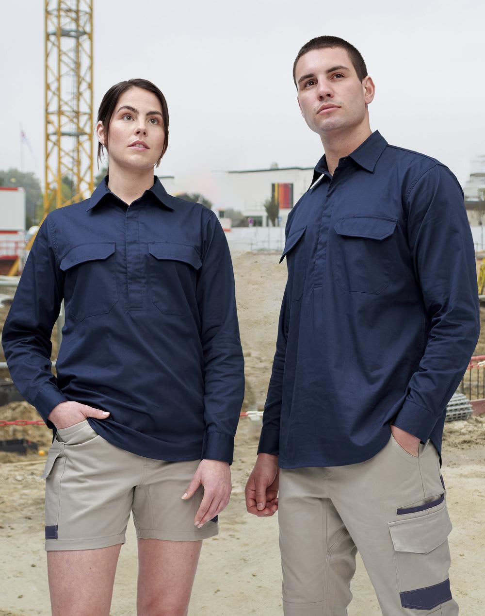 A closed front long sleeve work shirt in navy, displayed on a male and female model in a construction setting. Cool-Breeze Closed Front L/S Work Shirt - Image 1