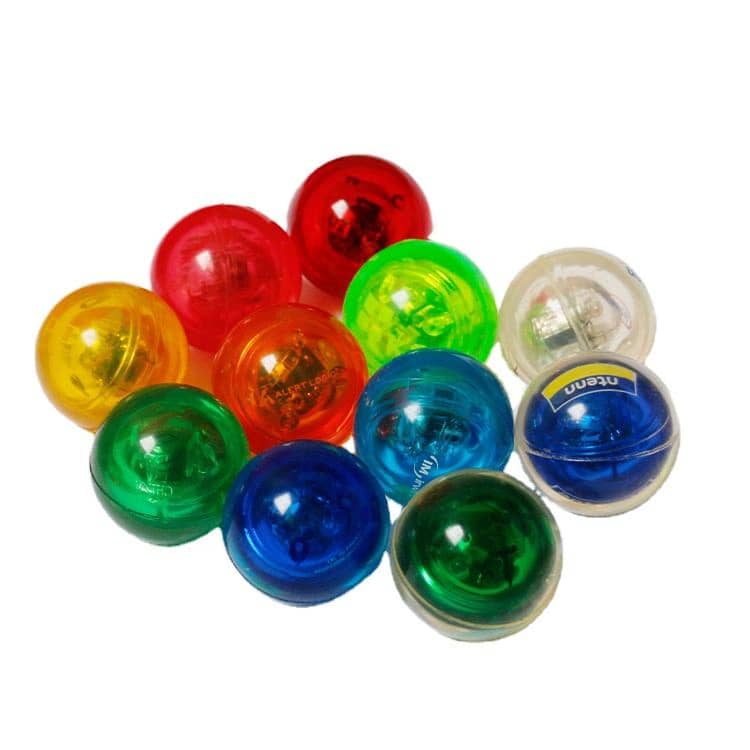 A collection of colourful, LED light-up bouncy balls in red, green, blue, yellow, and clear. Contains a prominent logo. LED Light Up Flashing Bouncy Ball - Image 1