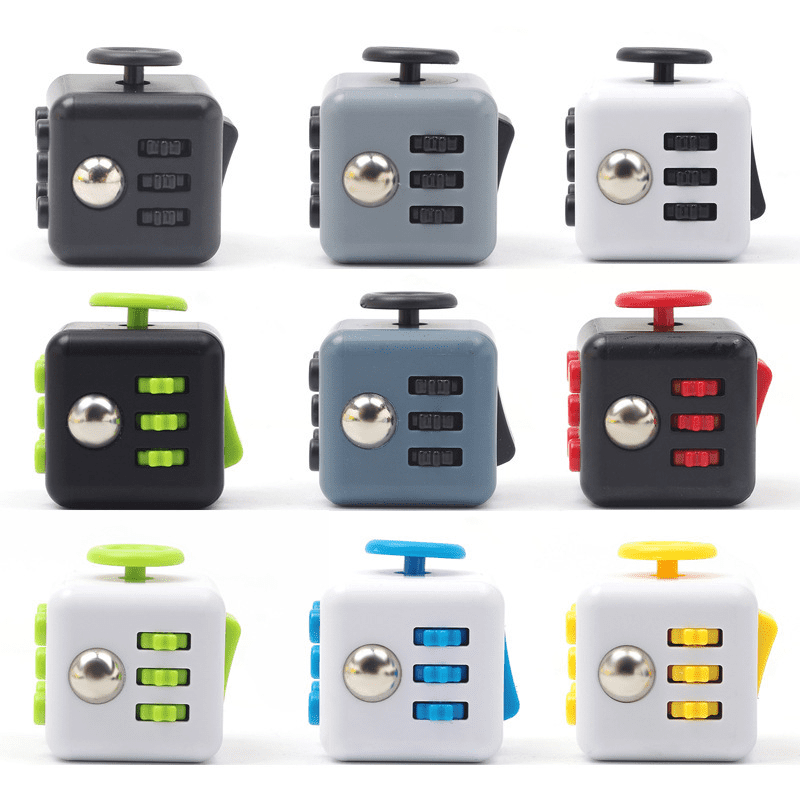 A variety of Fidget Cubes in black, grey, white, and assorted bright colours, featuring multiple tactile surfaces and a logo. Fidget Cubes - Image 1