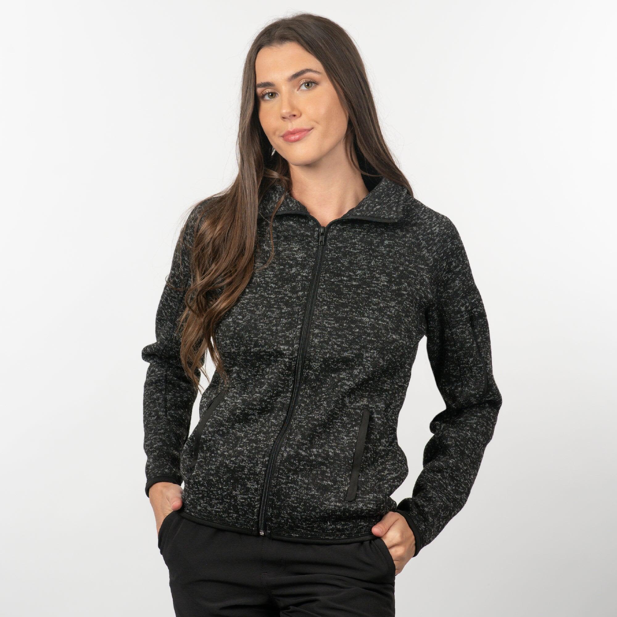 A full zip sweater knit jacket in black with a textured pattern and two side pockets. Features a stylish collar and a logo. Full Zip Sweater Knit Jacket - Image 1