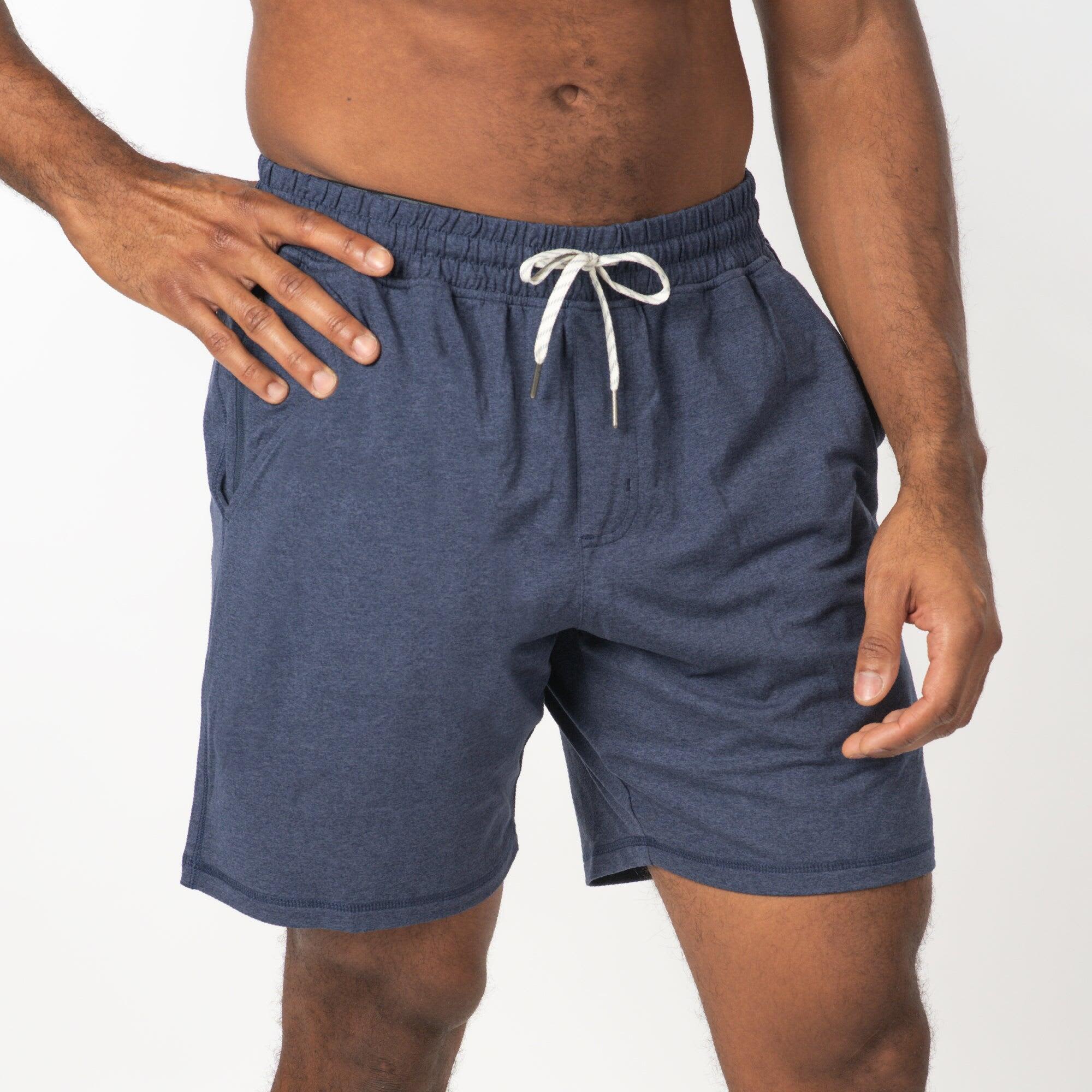 Soft jersey shorts in navy blue with an elastic waistband and drawstring. Features side pockets and a casual design. Soft Jersey Shorts - Image 1