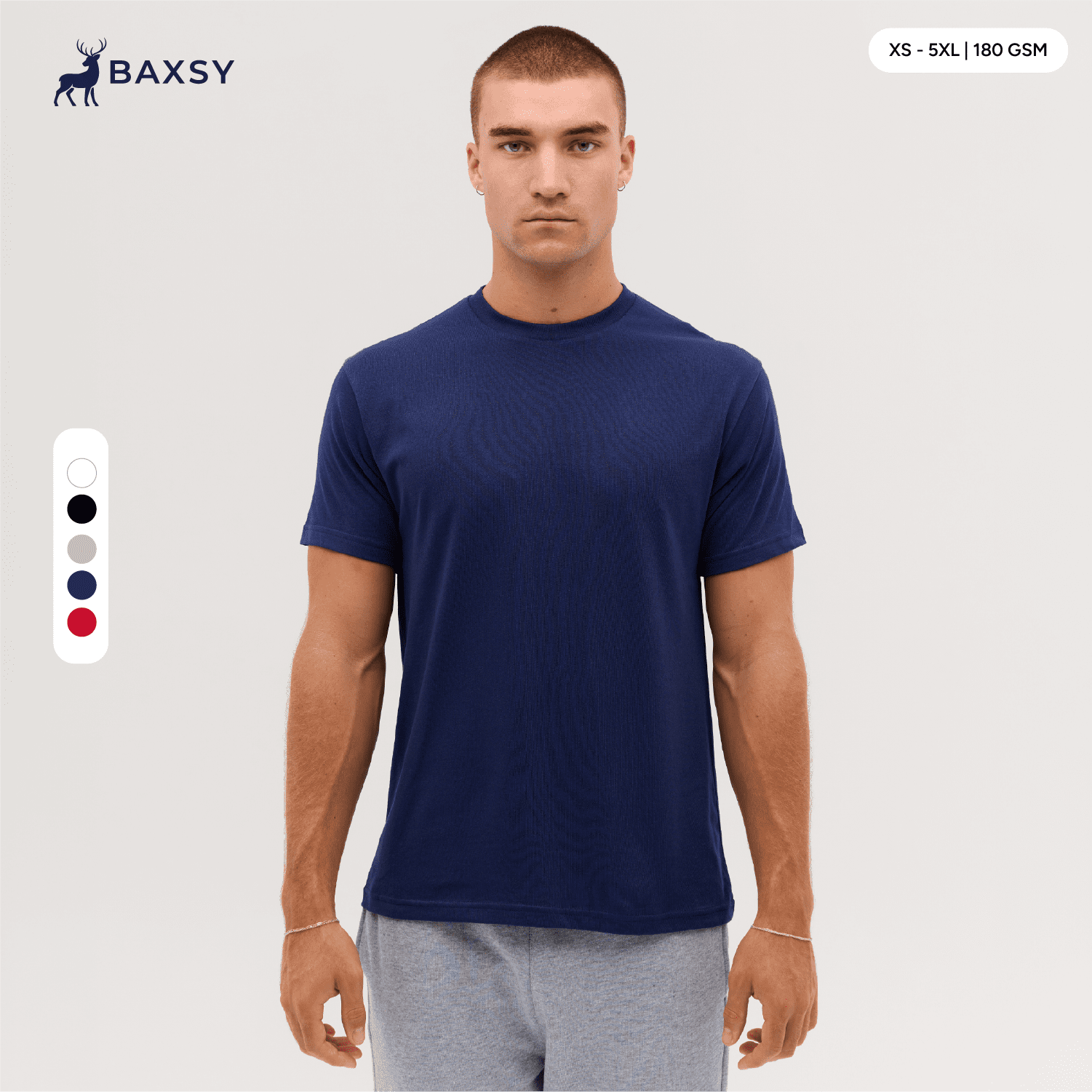 A navy blue T-shirt displayed on a model, featuring a round neckline and short sleeves. It has a logo. Reborn Tee - Image 1