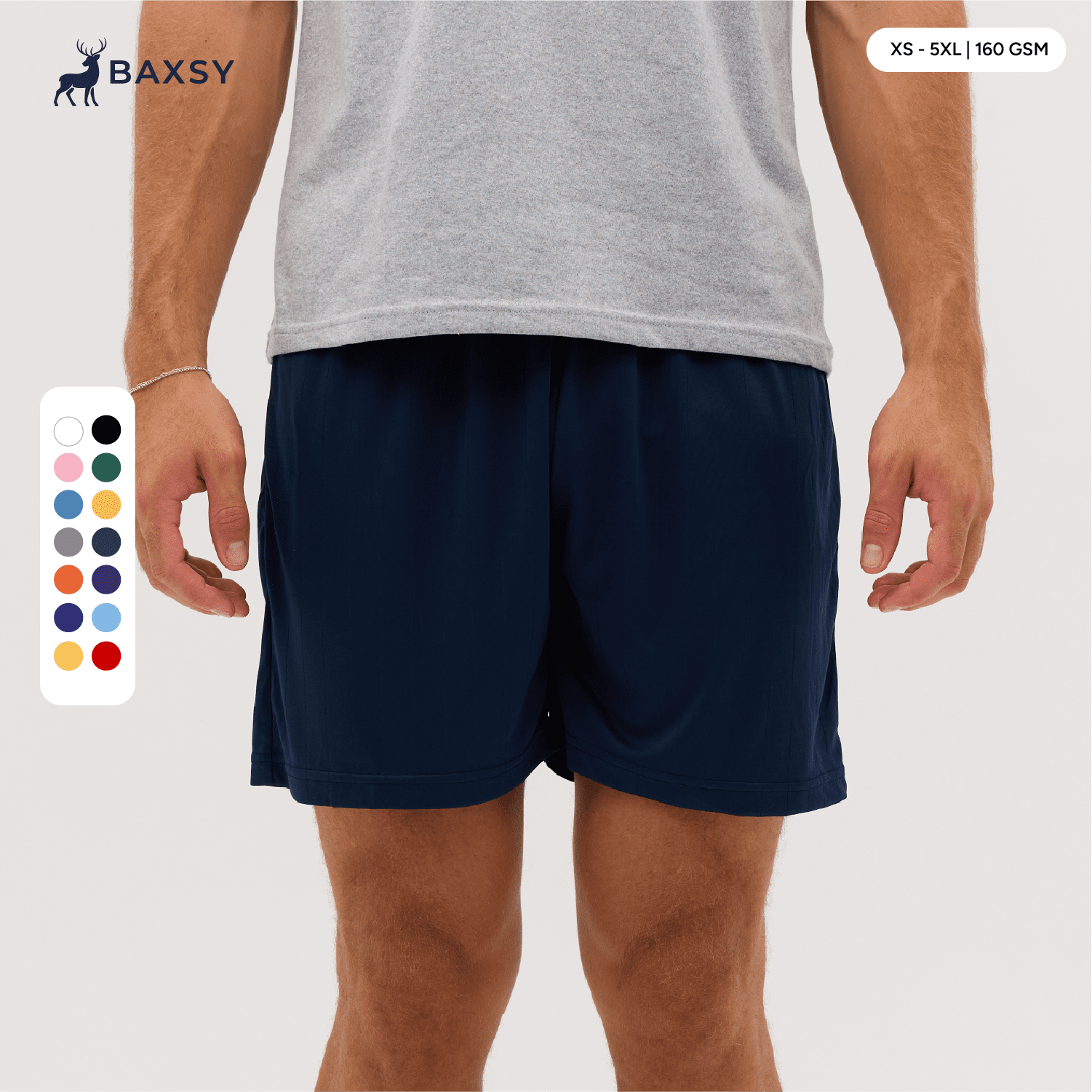 Navy shorts displayed on a model, featuring an elastic waistband and side pockets. Includes a colour selection chart. Core Shorts - Image 1