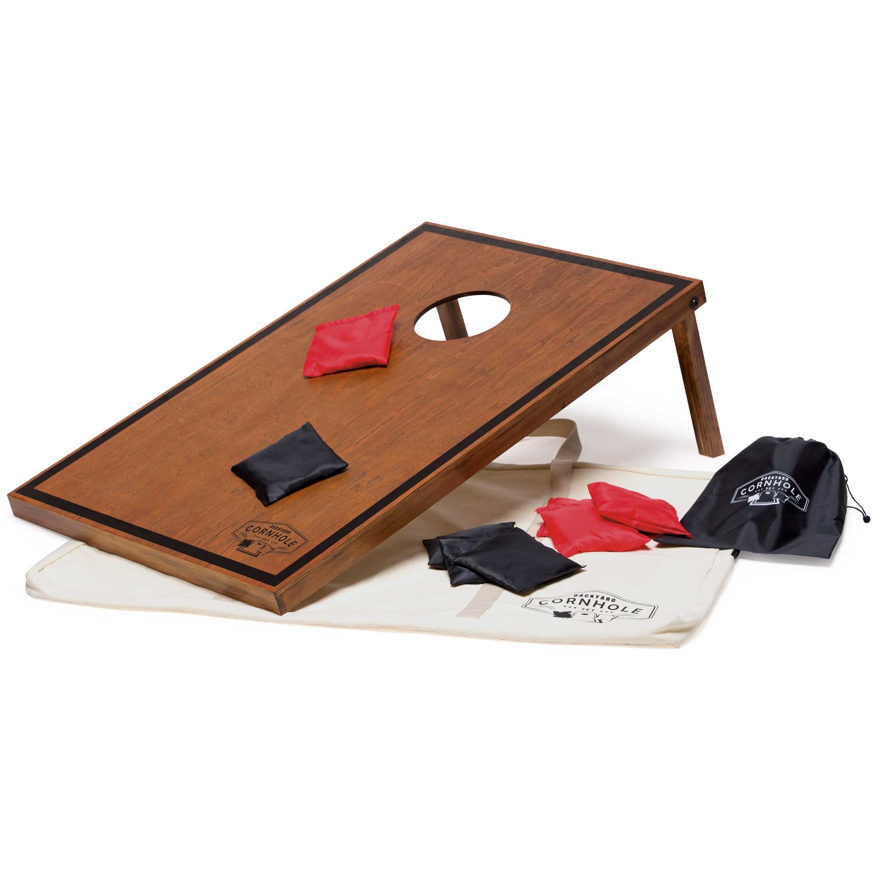 A wooden cornhole board in brown with a hole, red and black bean bags, and a carry bag in white. Backyard Cornhole Set - Image 1