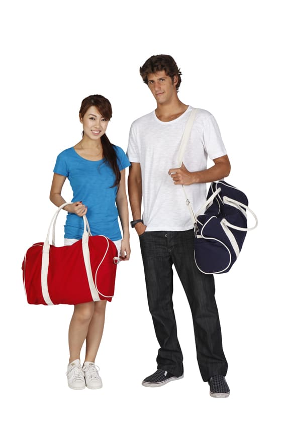A red duffle bag and a navy bag are held by a woman in a blue shirt and a man in a white shirt. Both bags have branding. Contrast Bag - Image 1