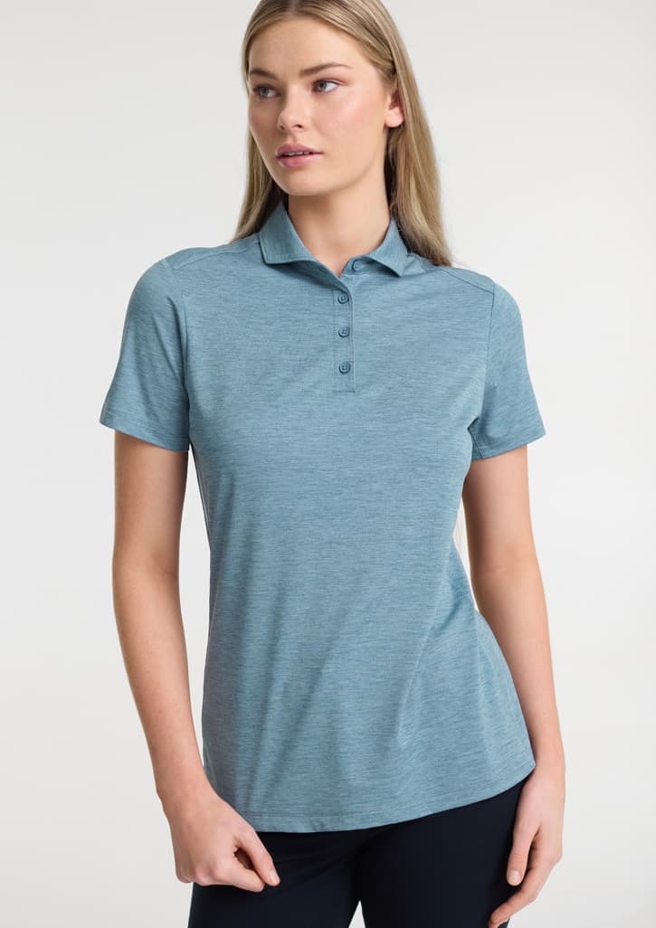 A women’s short sleeve polo in a light blue colour featuring a classic collar and a subtle logo. Womens Phoenix Short Sleeve Polo - Image 1