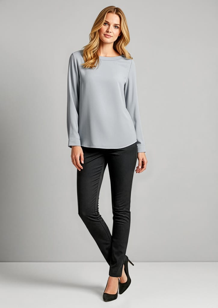 A model wearing grey top and black leggings stands against a plain background. The leggings have a sleek design and a logo. Womens Bella Pant - Image 1
