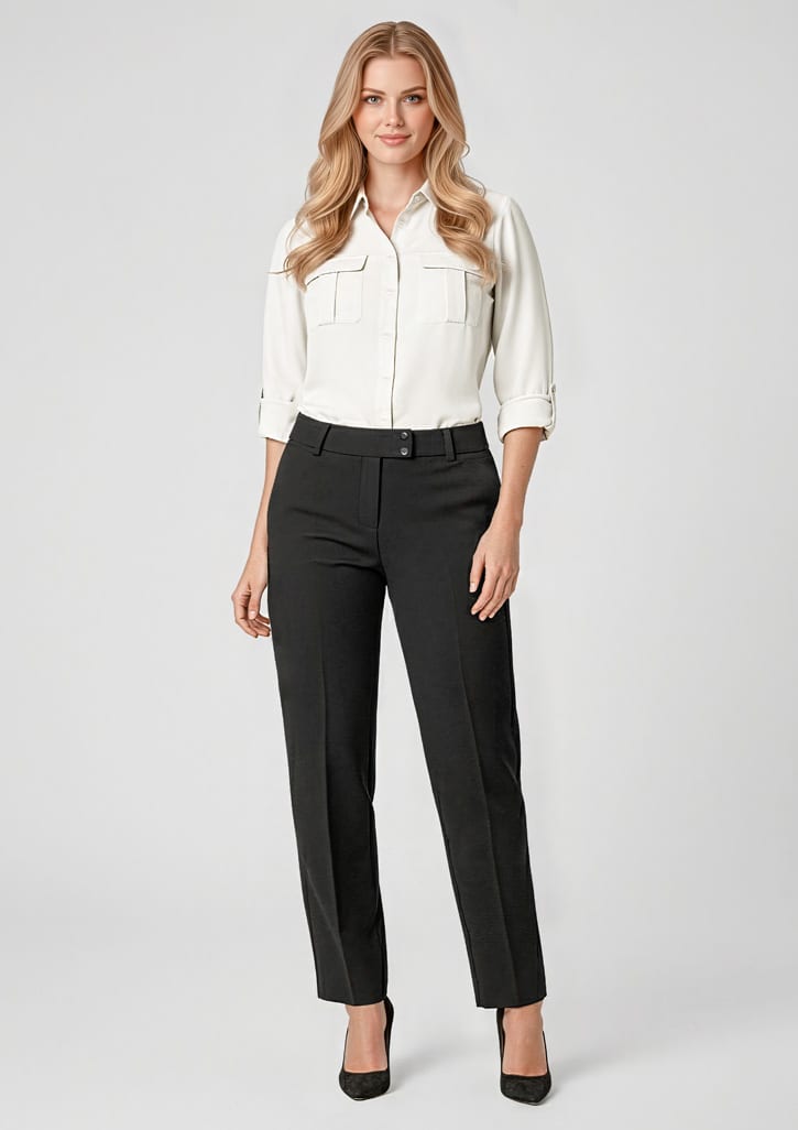 A woman wears black slacks paired with a white button-up shirt and heels, posing against a neutral background. Womens Eve Perfect Pant - Image 1