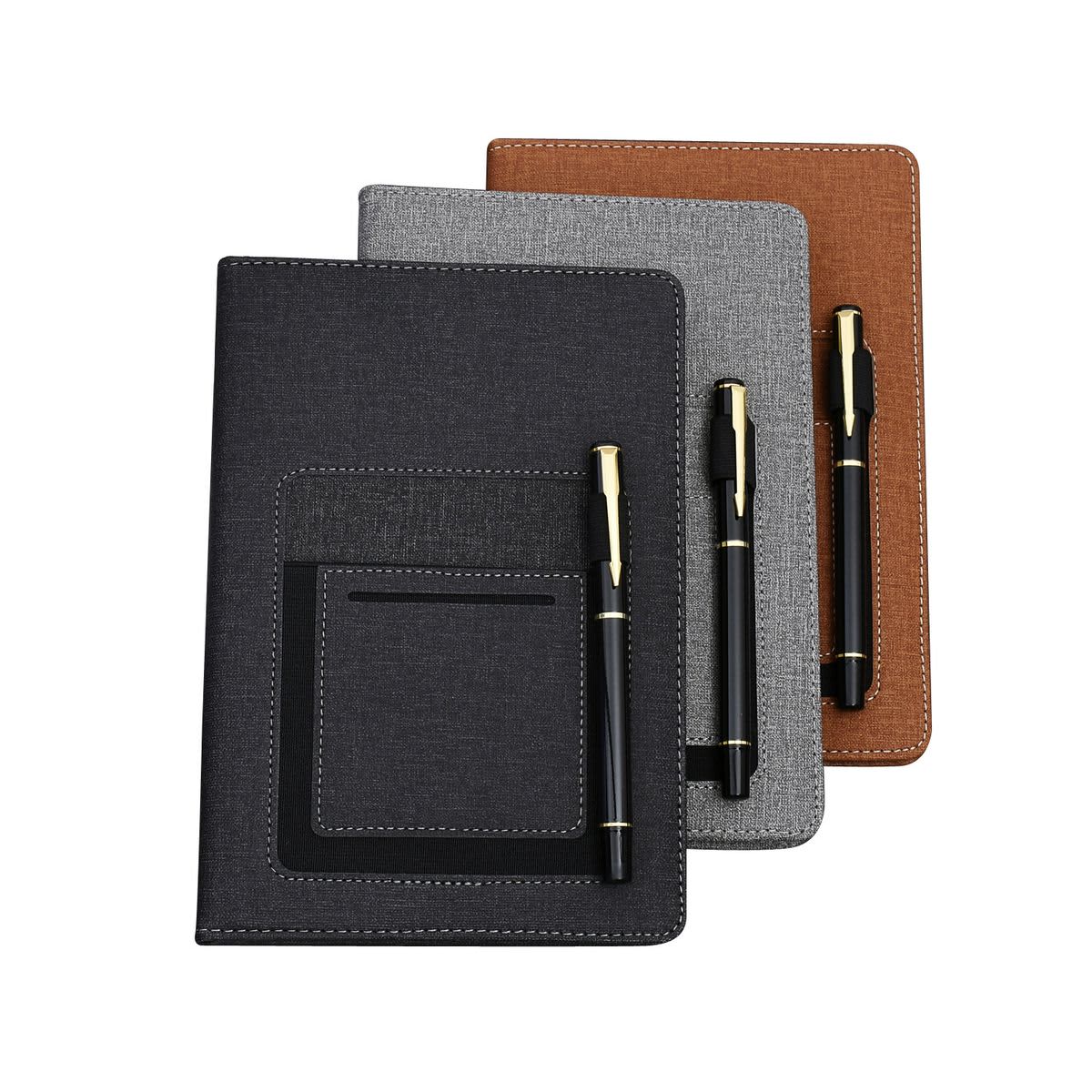A set of three notebooks in black, grey, and brown, each paired with a pen. All feature a pocket on the front. Noteboo with Pocket & Pen - Image 1