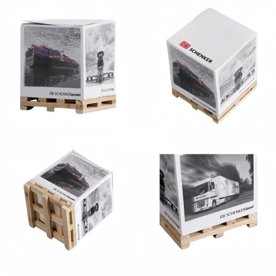 A cube of sticky notes sits on a wooden pallet, featuring a multicoloured design and branding on all sides. Cube Sticky Note with Pallet - Image 1