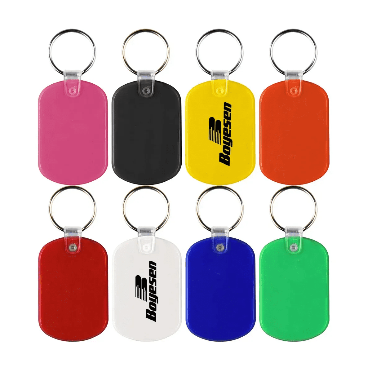 A collection of PVC key tags in pink, black, yellow, orange, white, blue, and green, featuring a logo on some. PVC Key Tag - Image 1