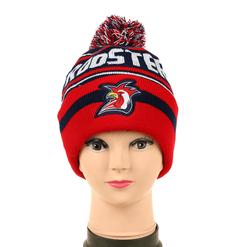 A red beanie hat with a pom-pom on top and a logo, featuring horizontal stripes in navy and white. Pom Beanie Hat - Image 1